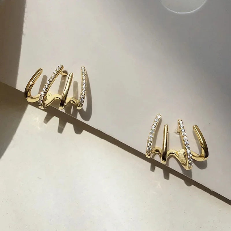 Lumière Contemporaine | Boucles d'Oreilles Dorées au Design Moderne